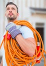 Electrician with wires cables on building site Royalty Free Stock Photo