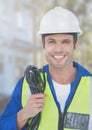 Electrician with wires cables on building site Royalty Free Stock Photo