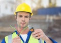 Electrician with wires cables on building site Royalty Free Stock Photo