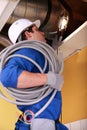Electrician wiring loft space Royalty Free Stock Photo