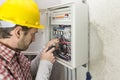 Electrician at work on an electrical panel