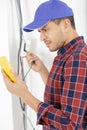 Electrician at work measures electric current Royalty Free Stock Photo