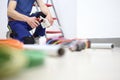 Electrician at work with nippers in hand cut the pipe to pass the cables to the socket for electrical wiring Royalty Free Stock Photo
