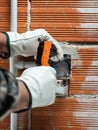 Electrician at work on a residential electrical system. Electricity Royalty Free Stock Photo