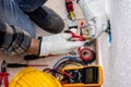 Electrician at work on a residential electrical system. Electricity Royalty Free Stock Photo