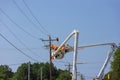 Electrician worker electric power pole maintenance industry to repair the damaged power line problems after the storm