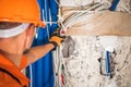 Electrician Worker Moving Bunch of Electric Cables