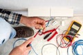 Electrician at work on a residential electrical system. Electricity Royalty Free Stock Photo