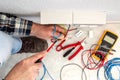 Electrician at work on a residential electrical system. Electricity Royalty Free Stock Photo