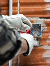 Electrician at work on a residential electrical system. Electricity Royalty Free Stock Photo