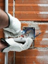 Electrician at work on a residential electrical system. Electricity Royalty Free Stock Photo