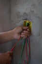 Electrician working on a construction site. Electrical wiring in a construction