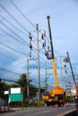 Electrician working on electric pole