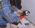 Electrician working in the electrical plant.