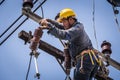 Electrician working on the electricity pole