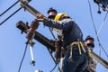 Electrician working on the electricity pole