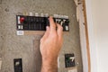 Electrician working on the fuse box Royalty Free Stock Photo