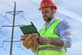 Electrician working in a helmet wearing gloves