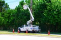 Electrician working on high power lines in a lift