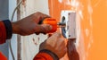 electrician working on a home electrical system, he is installing a wall socket.Generative AI