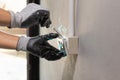 Electrician working safely on sockets of a residential electrical system