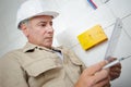 Electrician working in tiled room Royalty Free Stock Photo
