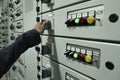 Electricians are checking electrical control panels in industrial plants