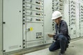 Electricians are checking electrical control panels in industrial plants