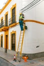 Electricians in the equipment on the stairs.