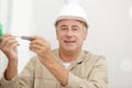 Electricians hands assembles standard bipolar wall socket Royalty Free Stock Photo