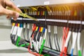 Electricians hands testing current electric in control panel