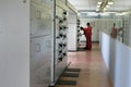 Electricians inspecting equipment in the switchboard room.