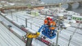 Electricians worked at autotower. Workers repair mast lighting. Aero view