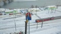 Electricians worked at autotower. Workers repair mast lighting. Aero view