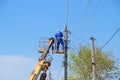 Electricians repair the power line. Workers are locksmith electricians.