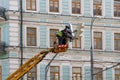 Electricians repair the traffic light