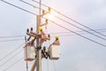 Electricians repairing wire of the power line with bucket hydraulic lifting platform Royalty Free Stock Photo