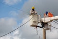 electricians repairing wire of the power line on electric power