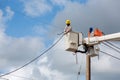 Electricians repairing wire of the power line on electric power Royalty Free Stock Photo