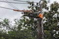 electricians repairing wire of the power line on electric power pole Royalty Free Stock Photo