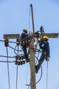 Electricians resting on the electricity pole