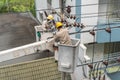 Electricians in the uniform are fixing a power line. A concept of power outage / blackout Royalty Free Stock Photo