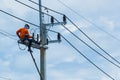 Electricians Wiring Cable repair services,worker in crane truck bucket fixes high voltage power transmission line, Royalty Free Stock Photo