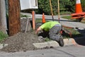 Electricians work and dig around a utility pole Royalty Free Stock Photo