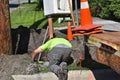 Electrician construction worker digs for underground wiring Royalty Free Stock Photo