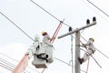 Electricians working on a crane car