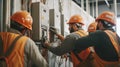 Electricians working on an electrical panel in a building Royalty Free Stock Photo