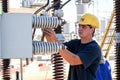 Electricians working on high voltage power lines