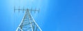 Electricity background banner panorama - Voltage power lines / high voltage electric transmission tower with blue sky and shining Royalty Free Stock Photo