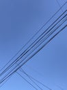 electricity cable over a blue sky Royalty Free Stock Photo